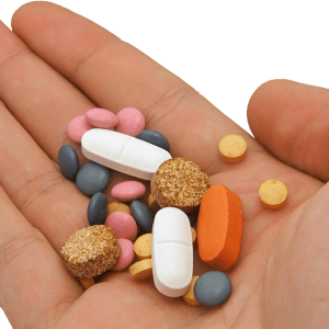 Pills in hand PNG